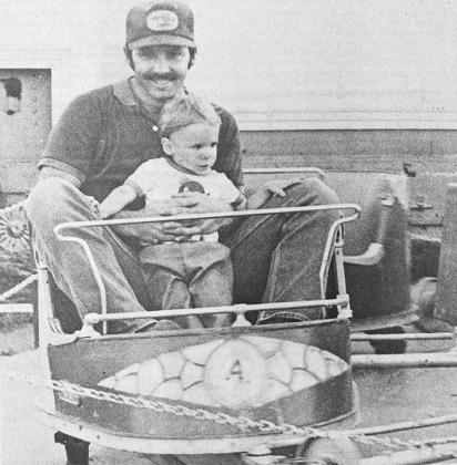 40 YEARS AGO Young Cody Weil took a spin accompanied by his dad, Dwain Weil, at the Girl Scout-sponsored carnival.