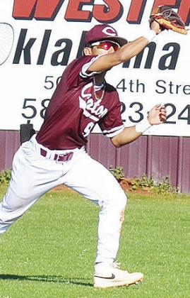 Clinton’s Azreal Fierros reaches out to catch the ball during the Reds’ home game Friday against Okarche during the final day of the I-40 Classic. CDN | Sam Goodwyn