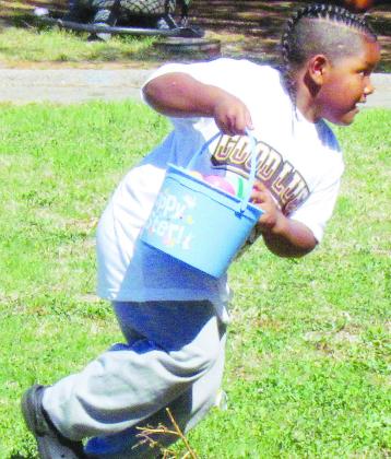 Khalil Douglas grabs an egg, before running to another at Eastside Academy. CDN | Christian Jacobsen