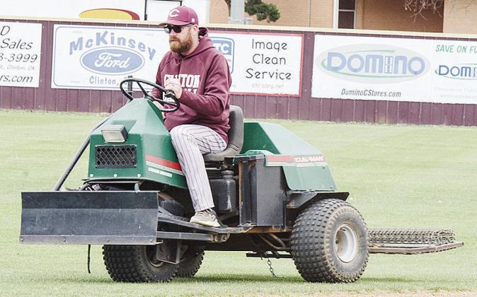 Micheal Deatherage rides the three-wheeler after smoothing the infield dirt prior to Clinton’s baseball home game against Kingfisher. CDN | Sam Goodwyn