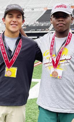 Clinton’s Sutton Hernandez, left, and Bryson Miles are all smiles after winning bronze in the Unified Boccee Ball event during the State Special Olympics at Oklahoma State. CDN |Courtesy Photo