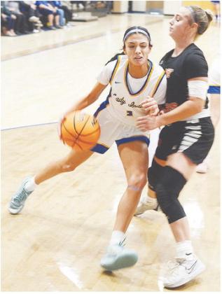 Arapaho-Butler’s Jada Akin drives through a Cheyenne-Reydon defender during the Lady Indians’ loss to the Lady Bears Saturday in the third-place match of the Western Equipment Classic in Arapaho. CDN | Sam Goodwyn