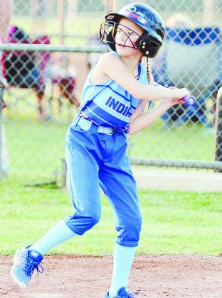 No. 7 Caroline Meacham focuses at the plate during A-B’s first game in the OK Kids 8U Softball State Tournament Wednesday night at Schumacher Fields at Acme Brick Park. CDN | Sam Goodwyn