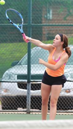 CDN | Collin Wieder � Clinton sophomore Emma Dowdell swings through the ball in a 2019 tournament. Dowdell and sister, Kate, earned fifth in the season-opening tourney.
