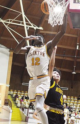 No. 5 Atticus Thompson takes to the air for the dunk during Clinton’s dominating win over Astec Charter in the Tornado Dome. CDN | Sam Goodwyn