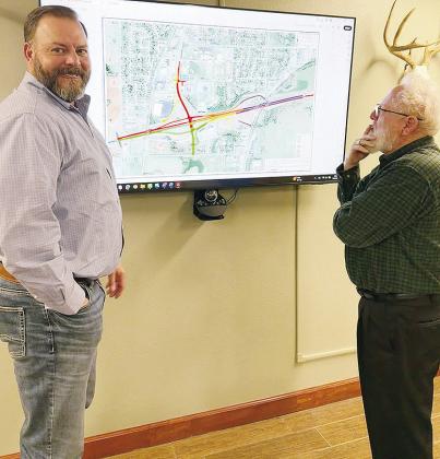 Oklahoma Department of Transportation Dist. 5 Engineer Will Snipes, left, and Clinton City Manager Robert Johnston discuss the updated phases of the upcoming Exit 65 project. CDN | Shiann Dawson