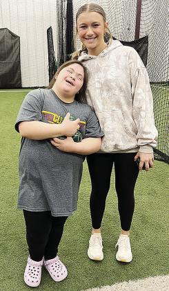 Paloma Rosales, left, laughs with Hadley Meget after competing in the Area Special Olympics Unified Bocce Ball Tournament at Clinton High School. CDN |Courtesy Photo
