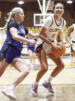 Clinton’s Lillian Lime braces to go up for a layup against a Newcastle defender during the Lady Reds’ basketball game against the Lady Racers in the Tornado Dome during the winter. CDN | Sam Goodwyn