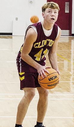 Zaryk Baker aims at the basket as he prepares to shoot during practice in the practice gym. CDN |Sam Goodwyn