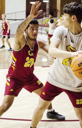 Clinton’s Cruz Rios, left, guards Davien Stanley during basketball practice in the Tornado Dome. CDN |Sam Goodwyn
