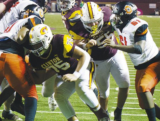 Clinton’s No. 75 Eli Anderson and No. 55 Bryson Snider work to open a hole for a ball carrier to run through in the Red Tornadoes’ home game against Douglass to end the regular season. CDN | Micah Ashcraft