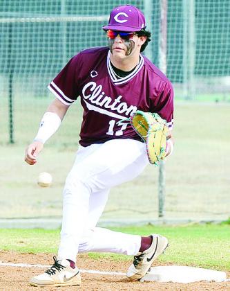 Clinton’s Kadon Rivera focuses on the ball as he prepares to catch it during the Reds’ game against Leedey. CDN | Sam Goodwyn