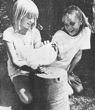 40 YEARS AGO Chickens like this Bantam White Wyanbotte, along with other poultry, had to undergo a pullorum-typhoid blood test at a special pre-entry testing session at the Custer County Fairgrounds in south Clinton. Shown admiring the chicken was its owner Shelley Bieberich, left, and Morgendee Meacham.