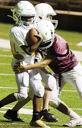 Camron Washington, right, tries to tackle No. 20 Cordae James during their game in the Tornado Bowl. CDN |Sam Goodwyn