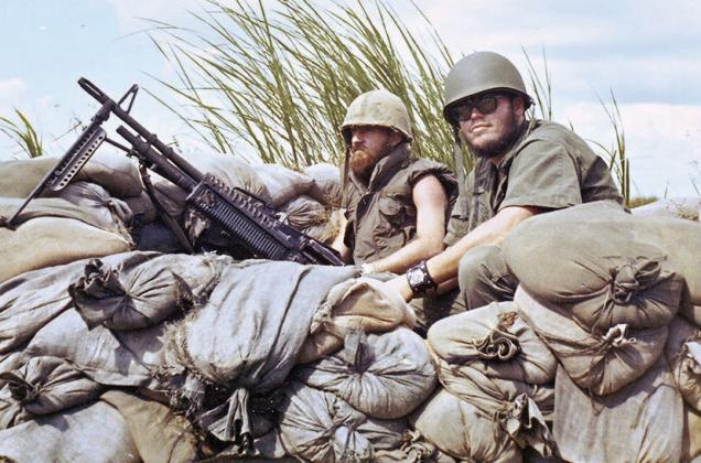Sam Hendricks, at right, mans his gun during the Vietnam War with his fellow soldier, Louvier.