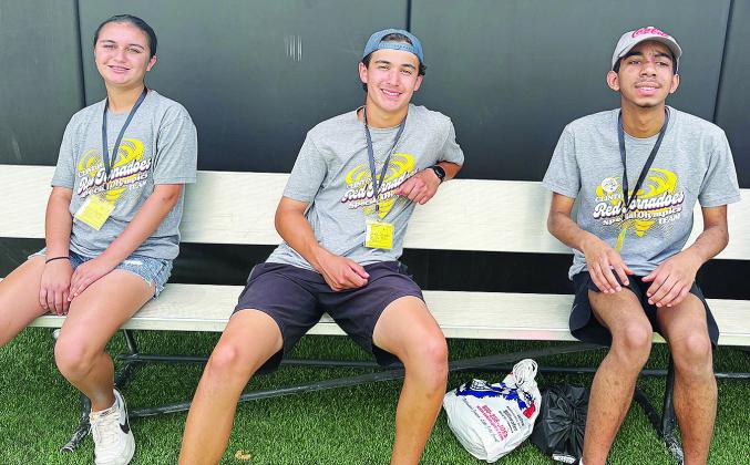 While taking a break from the State Special Olympics in Stillwater, from left, Sawyer Acosta, Scout Acosta, and Malique Guy are all smiles as they rest on the bench. CDN |Courtesy Photo