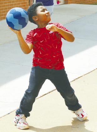 D’Angelo Bowens practices his hand-eye coordination by bouncing a ball off a wall at Southwest Elementary. CDN | Christian Jacobsen