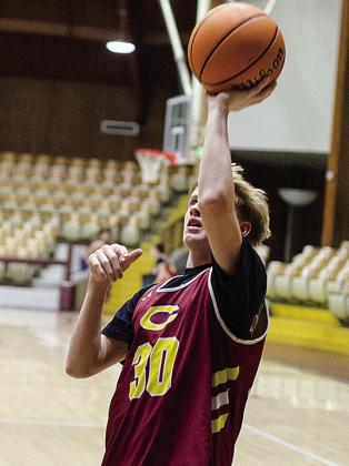 No. 30 Axl Deatherage goes up for the layup during warmups prior to the start of practice. CDN |Sam Goodwyn