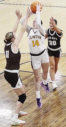 Clinton’s Brooklyn Aston shoots over an Elk City defender during the Lady Reds’ playoff game against the Elkettes. CDN | Sam Goodwyn
