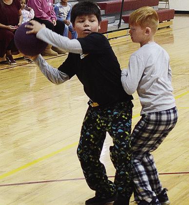 Garret Stockton, right, guards Kingston Gubitz during a March Madness game at Southwest Elementary. CDN | Sam Goodwyn