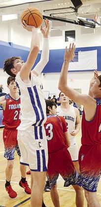 No. 23 Travis Cooke shoots over a defender during CBA’s home game against Sharon-Mutual. CDN | Sam Goodwyn