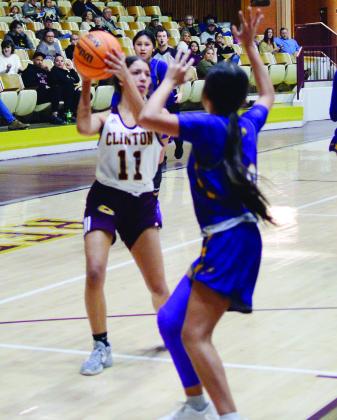 Clinton’s Rica Stennis looks for an opening to pass.