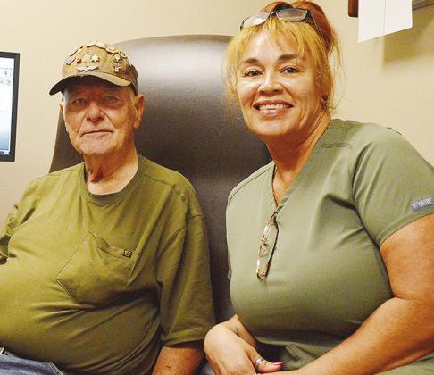 Veteran Edward Frye, left, gets an audiology exam with nurse Merry Jacobs at the Clinton VA Clinic. CDN | Micah Ashcraft