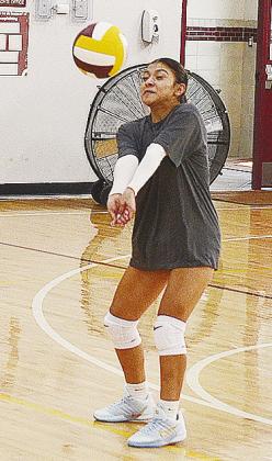 CDN | Sam Goodwyn Sammy Meraz return serves the ball back over the net during Clinton’s volleyball practice.