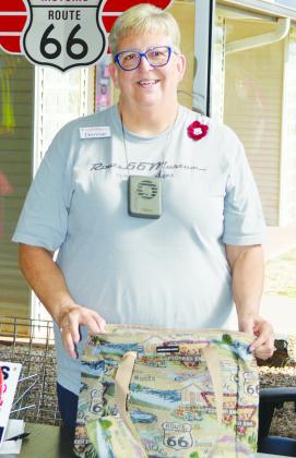 Volunteer Denise Davis greets visitors, answers questions, and helps register the visit on their museum passports at the Oklahoma Route 66 Museum. CDN | Christian Jacobsen