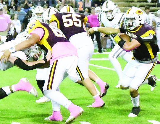Clinton’s Easten Powell, right, carries the ball while No. 66 Andre Lime and No. 55 Bryson Snider provide blocks during the Red Tornadoes’ home win over Elk City Friday. CDN | John Kinsey