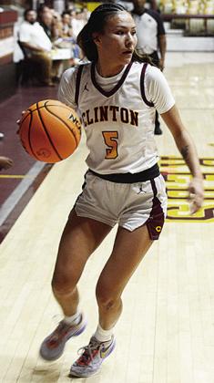 Clinton’s Lillian Lime dribbles the ball down the court during the Lady Reds’ recent home game against the Elk City Elkettes in the Tornado Dome. CDN | Sam Goodwyn