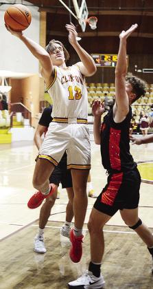 No.13 Ethan Lofland goes against a Lindsay defender as he attempts to take the ball to the basket during Clinton’s home game against the Leopards. CDN | Sam Goodwyn