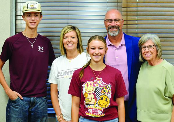 Nathan Meget was named superintendent of Clinton Pubic Schools Friday. From left are his son, Conner, his wife, Shea, his daughter, Hadley, Meget, and his mother, Teresa Grant.