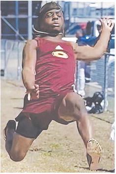 Clinton’s Marquis Martin flies through the air during the long jump event as a part of the track and field meet Monday at Plainview. CDN | Courtesy photo