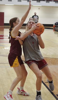Bella Bridgeman, left, battles with a Weatherford player, as she tries to stop her from scoring. CDN | Sam Goodwyn
