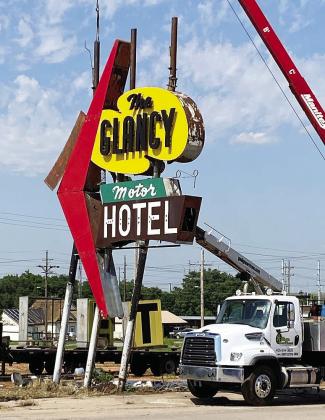 Crews worked Monday to remove the Glancy sign on Gary Boulevard. The sign will be refurbished and placed at the Oklahoma Rt. 66 Museum once the Oklahoma Highway Patrol Headquarters is torn down. CDN | Staff Photo