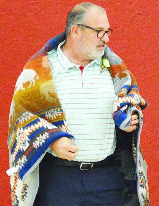 Brandon Lee, president of the Oklahoma Funeral Directors Association, was honored with a blanket by the Cheyenne and Arapaho Tribes Saturday at the Clinton ERC Building. CDN | Micah Ashcraft