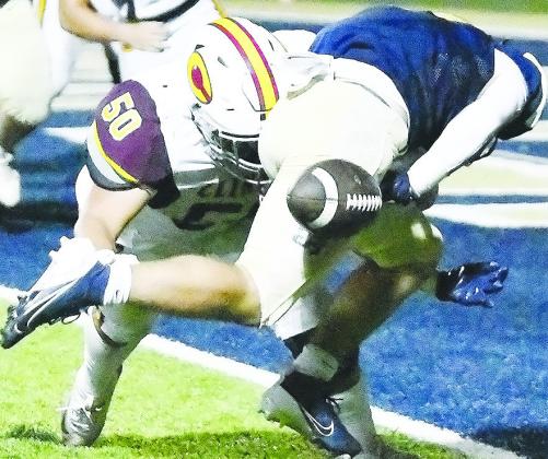 Clinton’s No. 50 Alex Amaya forces a fumble at the goal line during the Red Tornadoes’ road loss Friday to Kingfisher. CDN | John Kinsey
