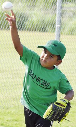 Antonio Martinez throws the ball during his Noon Lion’s Club T-Ball game at Schumacher Fields at Acme Brick Park. CDN |Sam Goodwyn