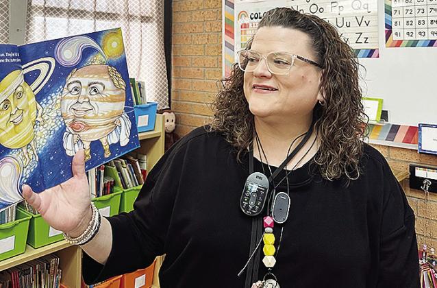 Nance Elementary School teacher Julie Parker reads from a book during class. CDN | Courtesy photo