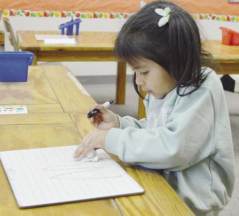 Mia Countryman learns her letters during after-school tutoring while at Eastside Academy. CDN | Micah Ashcraft