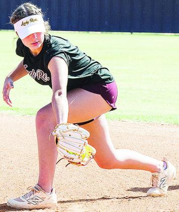 Clinton’s Reese Giblet back hands the ball as she goes through a fielding drill during practice at the high school softball field. CDN | Sam Goodwyn