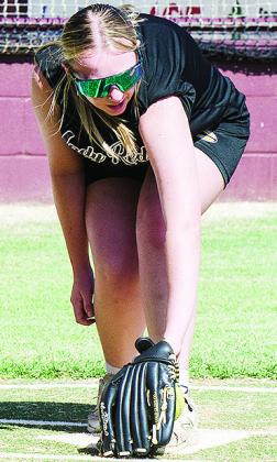 Olivia Cates fields the ball at home plate during Clinton’s softball practice. CDN | Sam Goodwyn