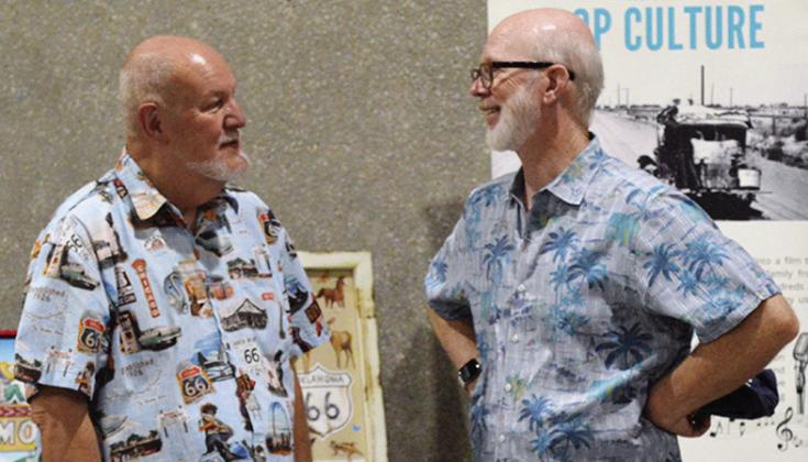 Rick Schmigle, left, and Greg Gordon visit during the Oklahoma Route 66 Association’s Hall of Fame ceremony at the Frisco Center. CDN | Christian Jacobsen