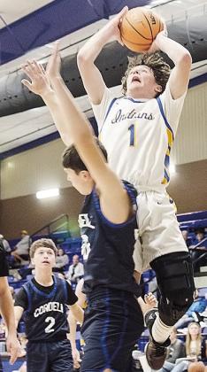 No. 1 Rylan Moore flies through the air as he goes for a layup during A-B’s win over Cordell Thursday in the final game of the first round of the Western Equipment Classic Tournament. CDN | Sam Goodwyn