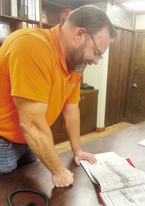 Will Snipes goes over plans for a project while in his new position as Oklahoma Department of Transportation Dist. 5 Engineer. CDN | Shiann Dawson