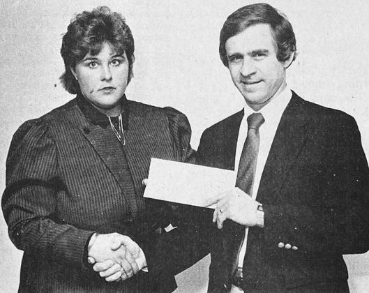 40 YEARS AGO Tonja Challis of Clinton was presented a $500 Oklahoma State University Agriculture Education Scholarship for the spring semester. Making the presentation was Mike Kastl, chairman of the board of directors of the Scholarship Program.