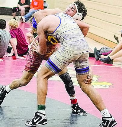 Clinton’s Tyson Brookter, top, grapples with his opponent during the recent Max Dippel Wrestling Tournament in Weatherford. CDN | Sam Goodwyn