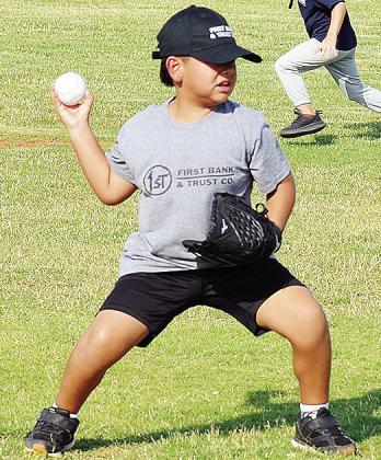 CDN | Sam Goodwyn AB Soto throws the ball to first base during one of his Noon Lion’s Club T-Ball games at Schumacher Fields at Acme Brick Park.