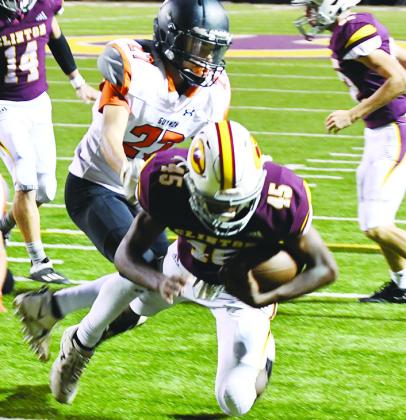 Clinton’s No. 45 Darrius Hicks dives past the defender into the endzone for his lone touchdown of the game against the Guymon Tigers.